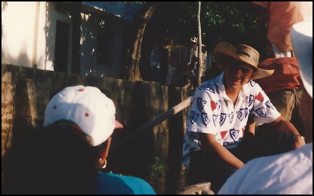 thoughtful young Colombian male
            in the shade of his own straw hat