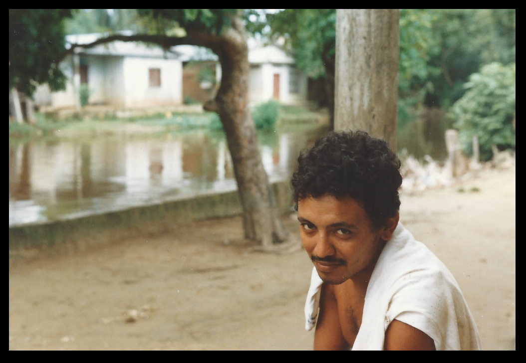 Egidio, one of the milk
              brothers, with the camino and a very full canal behind