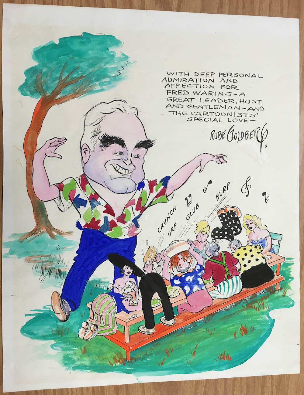 rowdy drinking gourmands picnic as
                directed by Fred Waring, color cartoon by Rube Goldberg