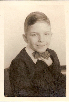 innocent-looking little boy mj in a Little Lord
                Fauntleroy suit with bowtie