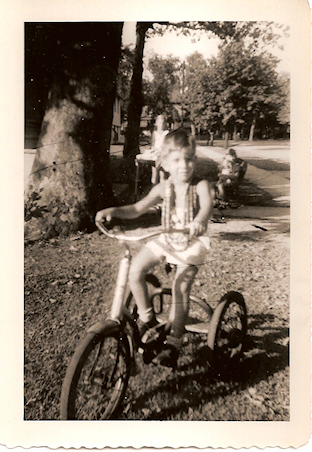 5 and a half year old mj on
                  tricycle, old family black and white