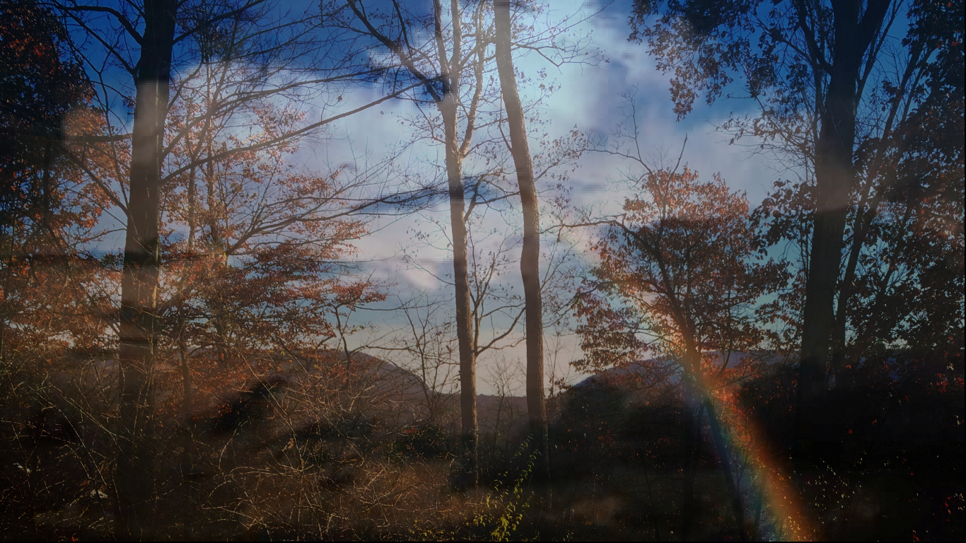 dark clouds over
              Delaware Water Gap offset by a rainbow